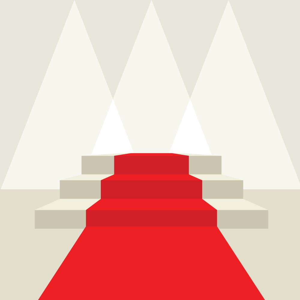 A red carpet placed on stairs with lights